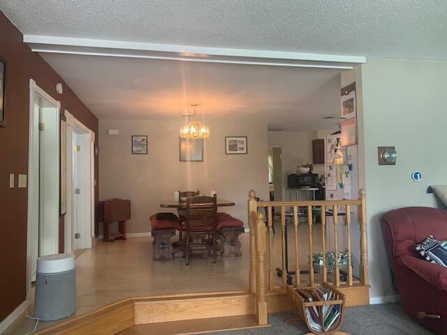 48 13th St, Bangor, ME 04401 - dining area with a chandelier and a textured ceiling