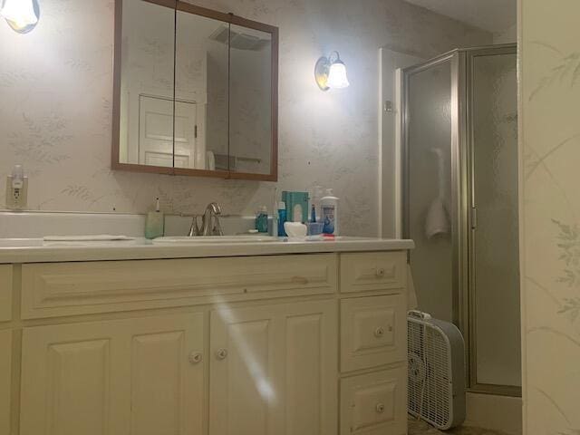 48 13th St, Bangor, ME 04401 - full bath with vanity, a stall shower, and wallpapered walls