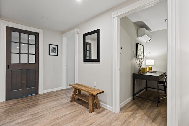 16 Guilford Ct Unit B1, Portland, ME 04101 - entryway with an AC wall unit and light wood-style floors