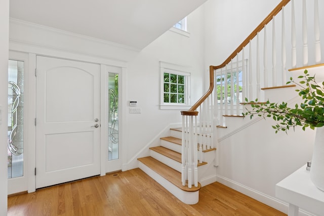 22 Channel Cove Ln, Biddeford, ME 04005 - foyer featuring stairway, plenty of natural light, and wood finished floors