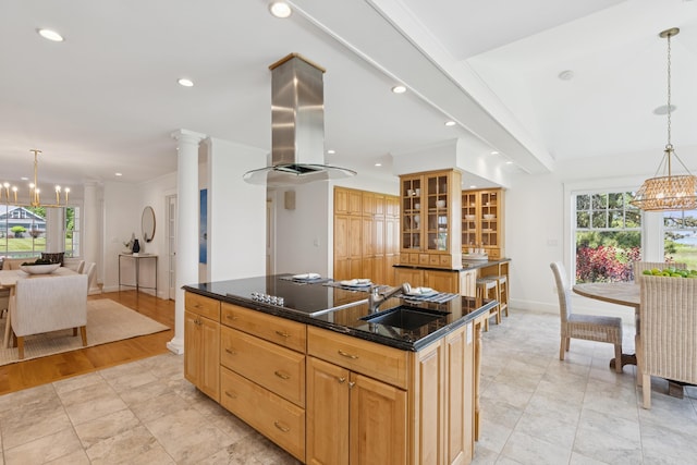 22 Channel Cove Ln, Biddeford, ME 04005 - kitchen featuring a chandelier, plenty of natural light, island range hood, glass insert cabinets, and recessed lighting