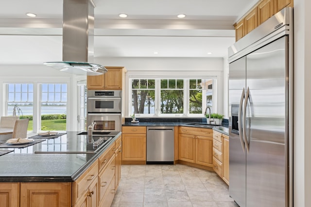 22 Channel Cove Ln, Biddeford, ME 04005 - kitchen with appliances with stainless steel finishes, island range hood, recessed lighting, a water view, and light brown cabinetry