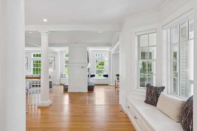 22 Channel Cove Ln, Biddeford, ME 04005 - entrance foyer with ornate columns, light wood finished floors, ornamental molding, and a decorative wall