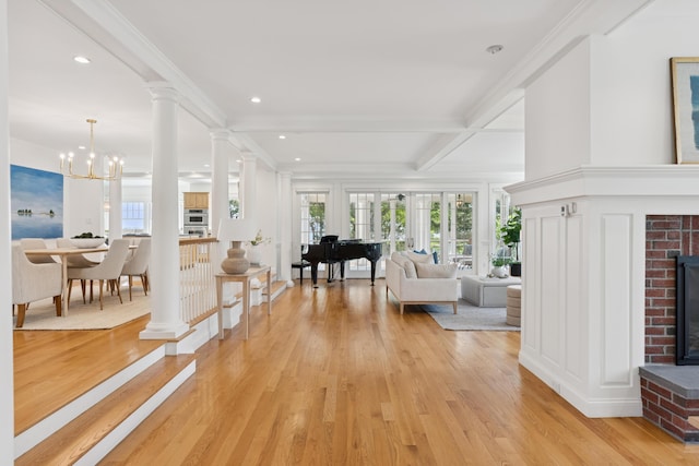 22 Channel Cove Ln, Biddeford, ME 04005 - living area featuring a fireplace, light wood-style flooring, recessed lighting, beam ceiling, and a chandelier
