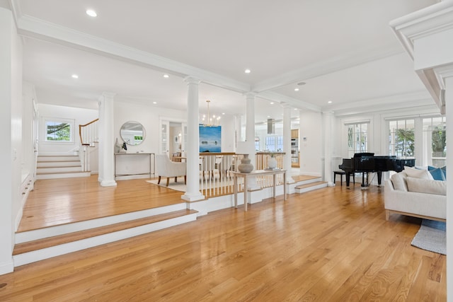 22 Channel Cove Ln, Biddeford, ME 04005 - living room with decorative columns, light wood-style flooring, healthy amount of natural light, stairway, and recessed lighting