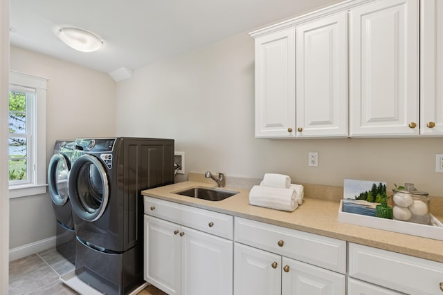 22 Channel Cove Ln, Biddeford, ME 04005 - laundry room featuring cabinet space, independent washer and dryer, and light tile patterned flooring