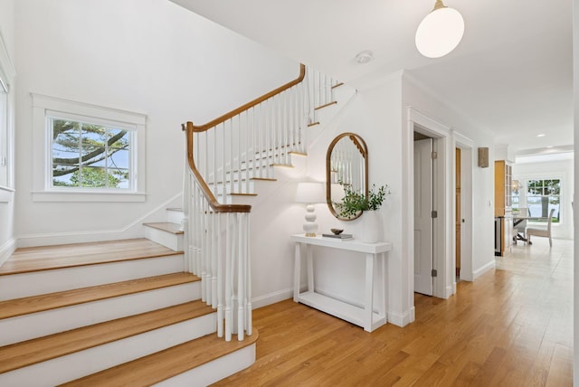 22 Channel Cove Ln, Biddeford, ME 04005 - stairway featuring plenty of natural light, wood finished floors, and ornamental molding
