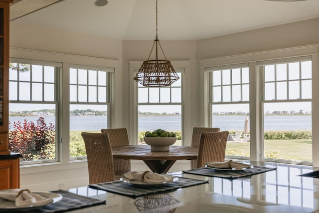 22 Channel Cove Ln, Biddeford, ME 04005 - dining space with a chandelier, a water view, and vaulted ceiling