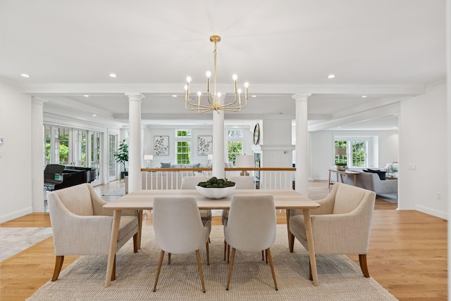 22 Channel Cove Ln, Biddeford, ME 04005 - dining space with decorative columns, recessed lighting, light wood-style floors, a chandelier, and crown molding