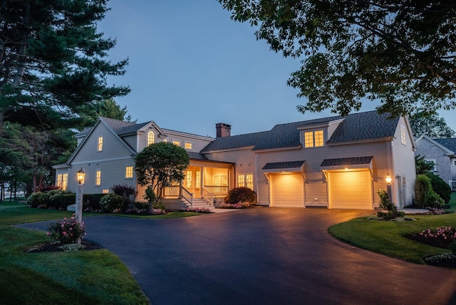 22 Channel Cove Ln, Biddeford, ME 04005 - view of front of home with driveway, a chimney, a shingled roof, and a front lawn