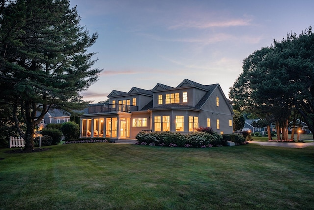 22 Channel Cove Ln, Biddeford, ME 04005 - back of property featuring a balcony, a yard, and a sunroom