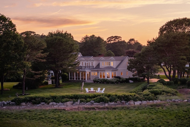 22 Channel Cove Ln, Biddeford, ME 04005 - view of front facade featuring a balcony, a front lawn, and a chimney