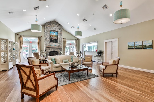1 Old County Rd Unit 140, Wells, ME 04090 - living room featuring a fireplace, baseboards, light wood-style flooring, high vaulted ceiling, and recessed lighting