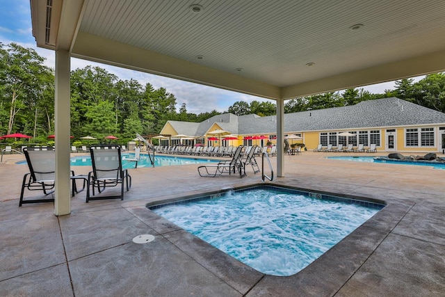 1 Old County Rd Unit 140, Wells, ME 04090 - community pool with a hot tub, a patio, and view of wooded area
