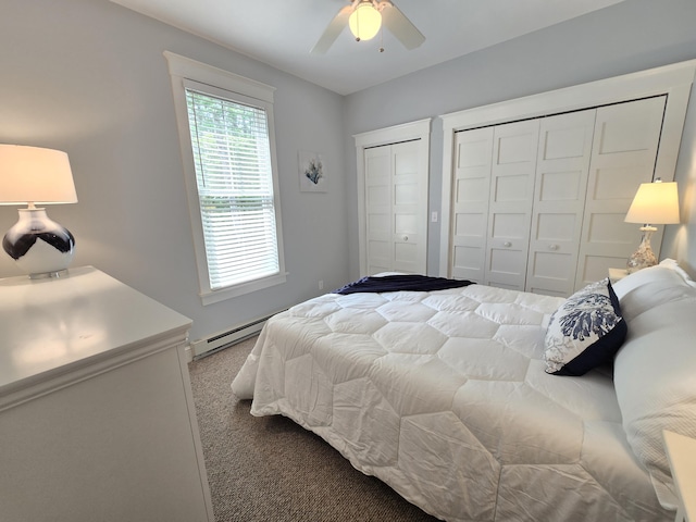 1 Old County Rd Unit 140, Wells, ME 04090 - carpeted bedroom with a baseboard heating unit, two closets, and a ceiling fan