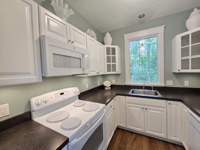 1 Old County Rd Unit 140, Wells, ME 04090 - kitchen featuring white appliances, dark countertops, white cabinets, and glass insert cabinets
