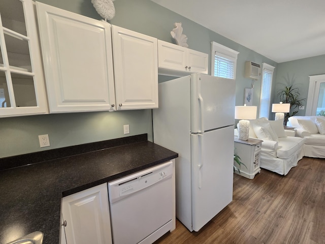 1 Old County Rd Unit 140, Wells, ME 04090 - kitchen with white appliances, dark countertops, white cabinets, dark wood finished floors, and glass insert cabinets
