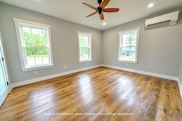 5 Whitetail St, Belfast, ME 04915 - unfurnished room with a wall mounted air conditioner, plenty of natural light, a ceiling fan, hardwood / wood-style floors, and recessed lighting
