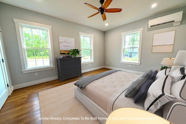 5 Whitetail St, Belfast, ME 04915 - bedroom with multiple windows, a wall mounted air conditioner, wood finished floors, and recessed lighting