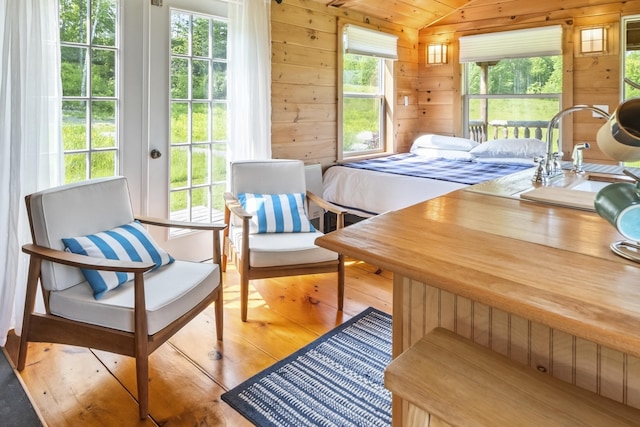 1535 Bailey Rd, Knox, ME 04986 - bedroom with lofted ceiling, wood-type flooring, and wood walls