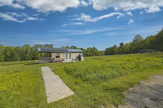 1535 Bailey Rd, Knox, ME 04986 - view of grassy yard with french doors and a view of trees