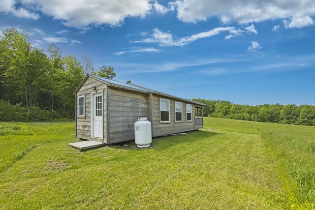 1535 Bailey Rd, Knox, ME 04986 - back of house with a lawn and an outbuilding