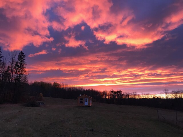 1535 Bailey Rd, Knox, ME 04986 - yard at dusk featuring a storage shed