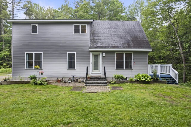 47 Double M Ln, Woolwich, ME 04579 - rear view of property featuring a lawn, roof with shingles, and a deck