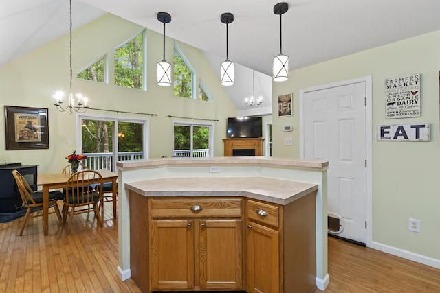 47 Double M Ln, Woolwich, ME 04579 - kitchen featuring a chandelier, plenty of natural light, light wood finished floors, and high vaulted ceiling