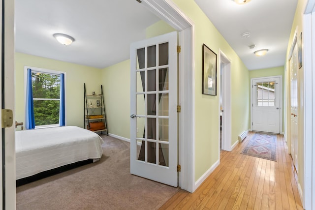 47 Double M Ln, Woolwich, ME 04579 - bedroom featuring a baseboard heating unit and light wood-type flooring