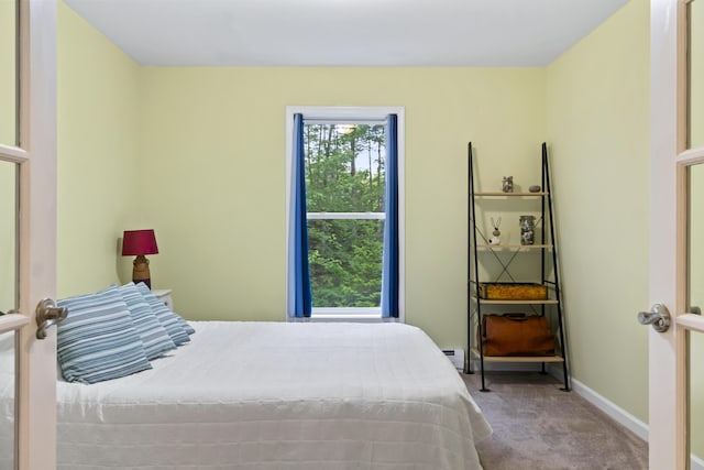 47 Double M Ln, Woolwich, ME 04579 - carpeted bedroom featuring baseboards and a baseboard radiator
