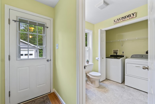 47 Double M Ln, Woolwich, ME 04579 - laundry area featuring washer and clothes dryer and light tile patterned floors