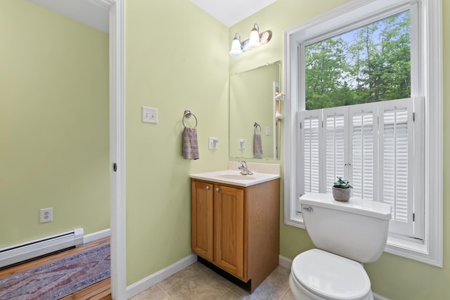 47 Double M Ln, Woolwich, ME 04579 - bathroom featuring a baseboard radiator, vanity, and tile patterned floors