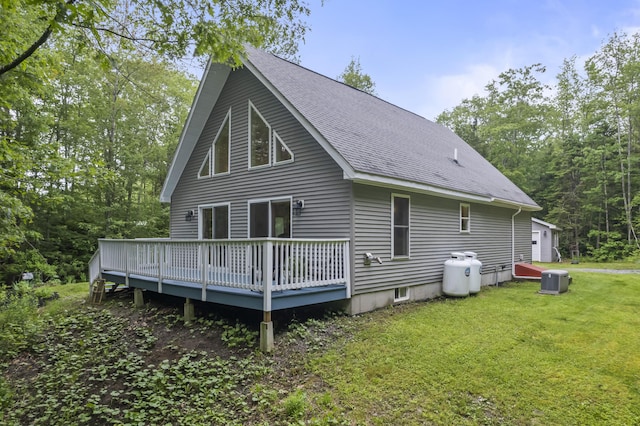 47 Double M Ln, Woolwich, ME 04579 - rear view of house featuring a wooden deck, a shingled roof, and a lawn