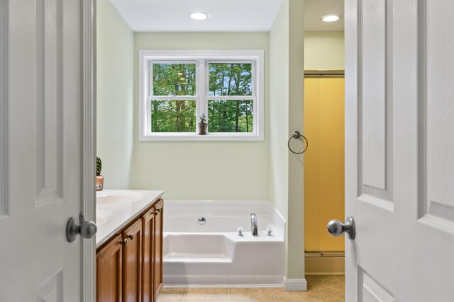 47 Double M Ln, Woolwich, ME 04579 - bathroom with a garden tub, vanity, and tile patterned floors
