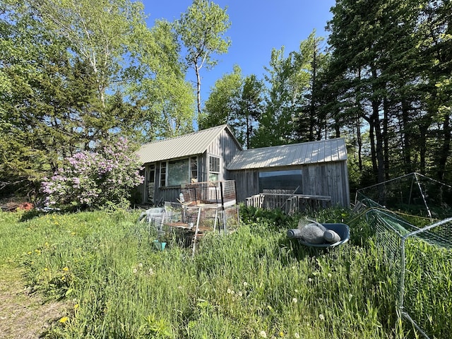396 Smyrna Town Line Rd, Smyrna, ME 04780 - rear view of property with a metal roof
