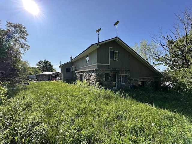 396 Smyrna Town Line Rd, Smyrna, ME 04780 - rear view of property with stone siding