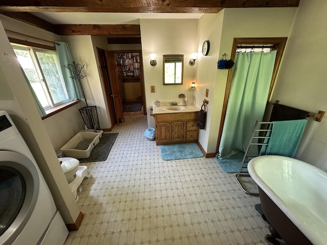 396 Smyrna Town Line Rd, Smyrna, ME 04780 - bathroom with washer / clothes dryer, vanity, a shower with curtain, and a bathtub