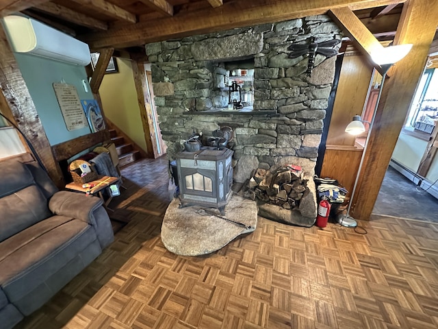 396 Smyrna Town Line Rd, Smyrna, ME 04780 - living area featuring stairway and a wood stove