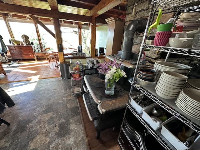 396 Smyrna Town Line Rd, Smyrna, ME 04780 - sunroom / solarium featuring a wood stove
