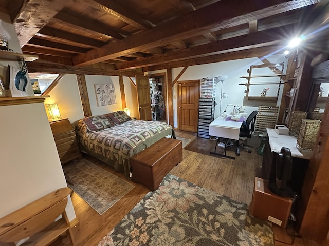 396 Smyrna Town Line Rd, Smyrna, ME 04780 - bedroom featuring wood finished floors, an office area, and a wooden ceiling with exposed beams