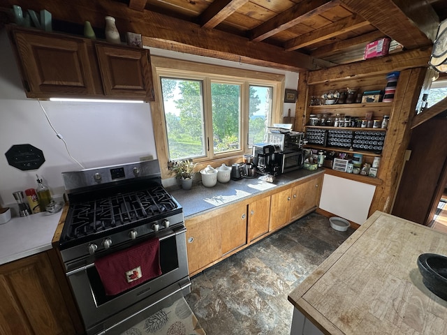 396 Smyrna Town Line Rd, Smyrna, ME 04780 - kitchen with gas stove, a wood ceiling with exposed beams, light countertops, and dark stone finish floors