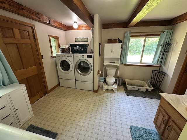 396 Smyrna Town Line Rd, Smyrna, ME 04780 - laundry room featuring independent washer and dryer and cabinet space