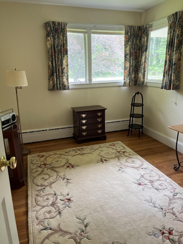241 Bristol Rd, Damariscotta, ME 04543 - sitting room featuring wood finished floors and a baseboard radiator