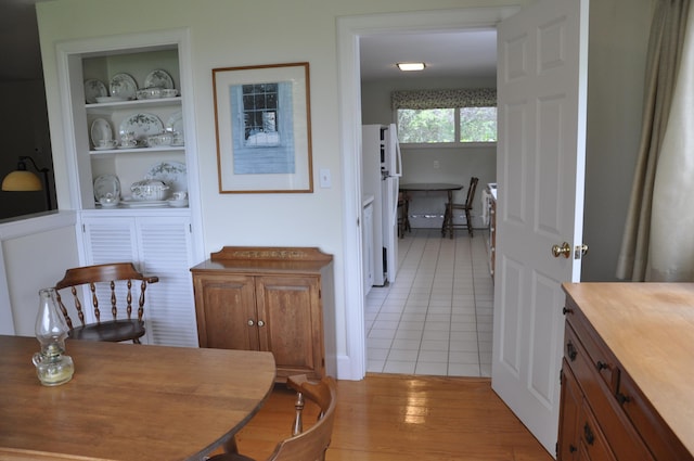 241 Bristol Rd, Damariscotta, ME 04543 - dining room featuring light tile patterned floors and built in shelves