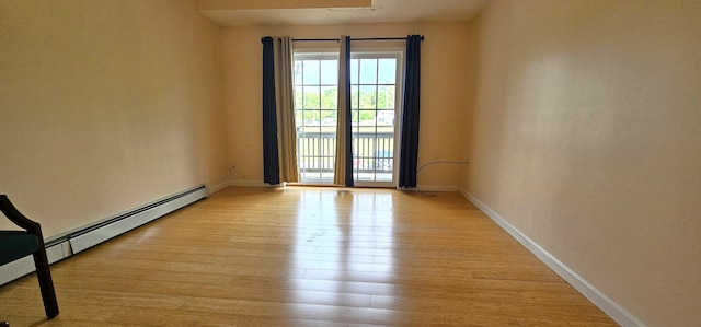35 Mathews Ave Unit 6, Waterville, ME 04901 - unfurnished room with a baseboard heating unit and light wood-type flooring