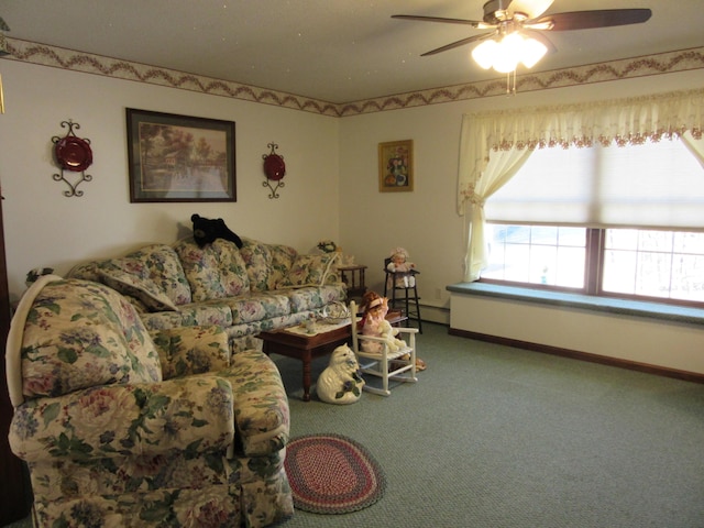 242 Newport Rd, Corinna, ME 04928 - living area with carpet floors, a ceiling fan, and a baseboard radiator