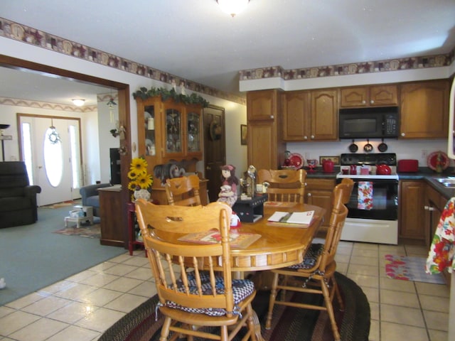 242 Newport Rd, Corinna, ME 04928 - dining space featuring light tile patterned floors