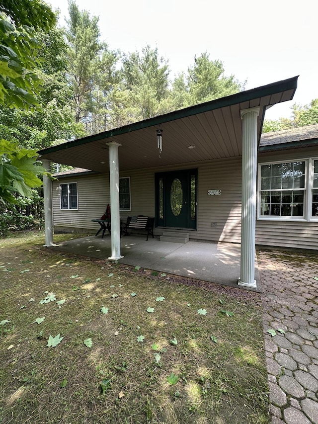 242 Newport Rd, Corinna, ME 04928 - rear view of house featuring a porch