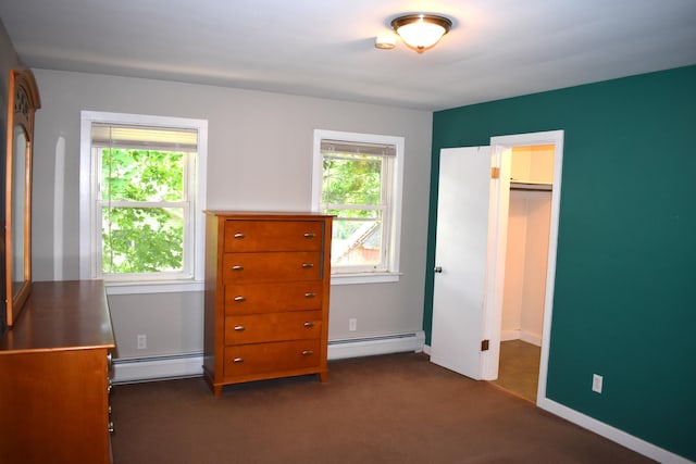 25 Ariel St, Lincoln, ME 04457 - bedroom featuring a baseboard heating unit, multiple windows, and dark colored carpet